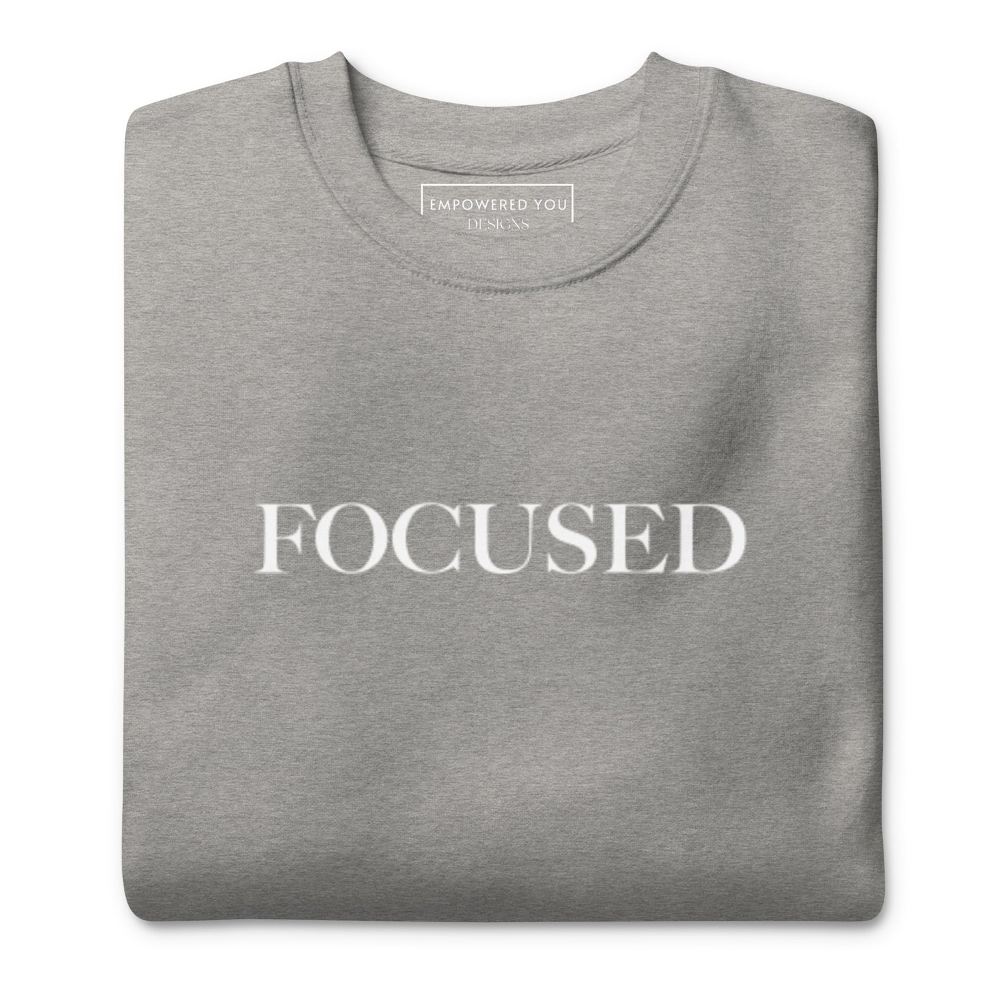 "FOCUSED" in white text (Front) & "Be the energy you want to attract" in white text (Back) - Premium Sweatshirt - EMPOWERED YOU DESIGNS, LLC