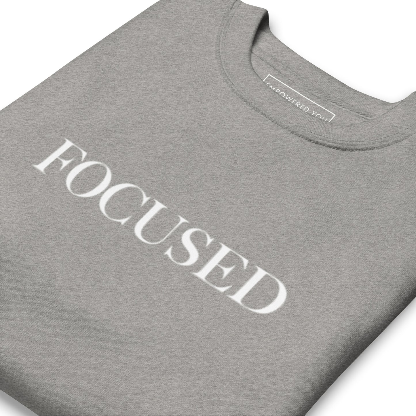 "FOCUSED" in white text (Front) & "Be the energy you want to attract" in white text (Back) - Premium Sweatshirt - EMPOWERED YOU DESIGNS, LLC