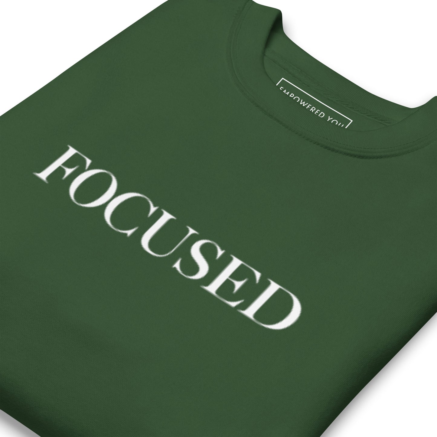 "FOCUSED" in white text (Front) & "Be the energy you want to attract" in white text (Back) - Premium Sweatshirt - EMPOWERED YOU DESIGNS, LLC