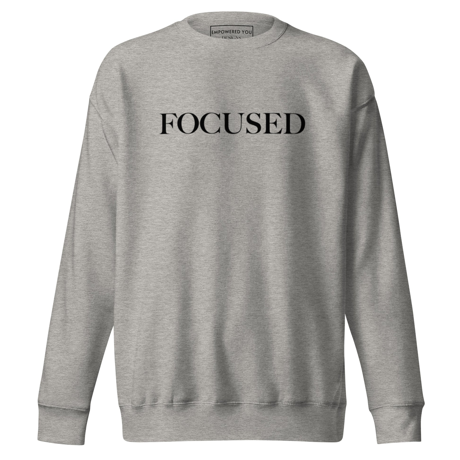 "FOCUSED" in black text (Front) & "Be the energy you want to attract" in black text (Back) - Premium Sweatshirt